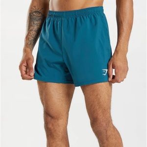 ARRIVAL 5" SHORTS Atlantic Blue
- Open side pockets
- 100% Polyester
